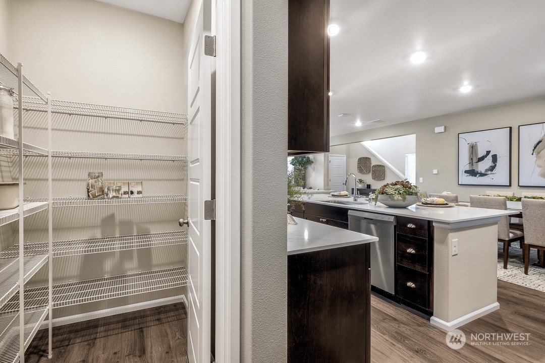 1606 12th Place, Unit 1161 Sultan, WA 98294 - Photo 9 of 20 a kitchen with a sink and cabinets