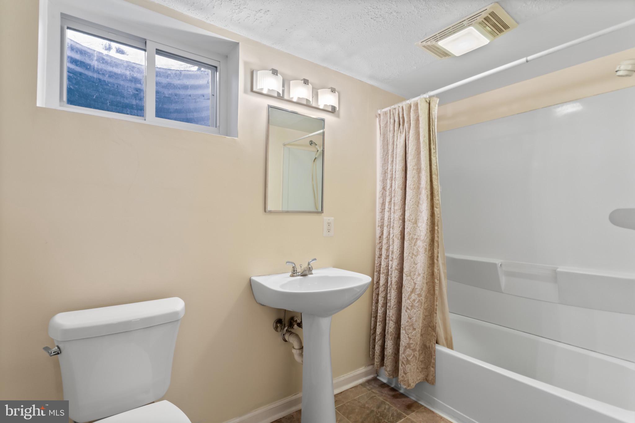 18 Hahn Road Westminster, MD 21157 - Photo 15 of 22 a bathroom with a sink toilet and shower