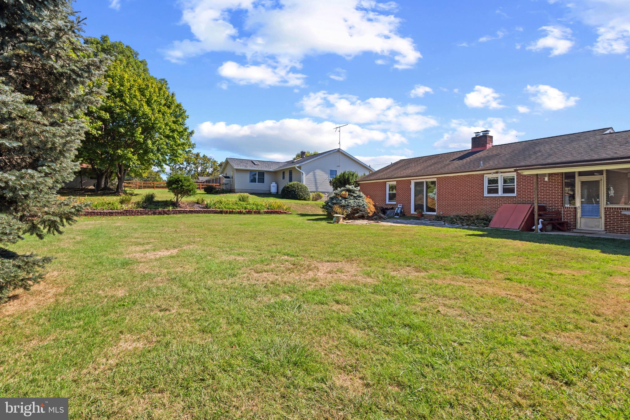 18 Hahn Road Westminster, MD 21157 - Photo 3 of 22 a view of a house with a big yard and large trees