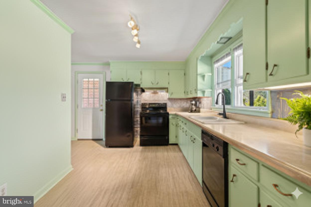 18 Hahn Road Westminster, MD 21157 - Photo 5 of 22 a kitchen with stainless steel appliances granite countertop a refrigerator a sink a stove and a wooden floors