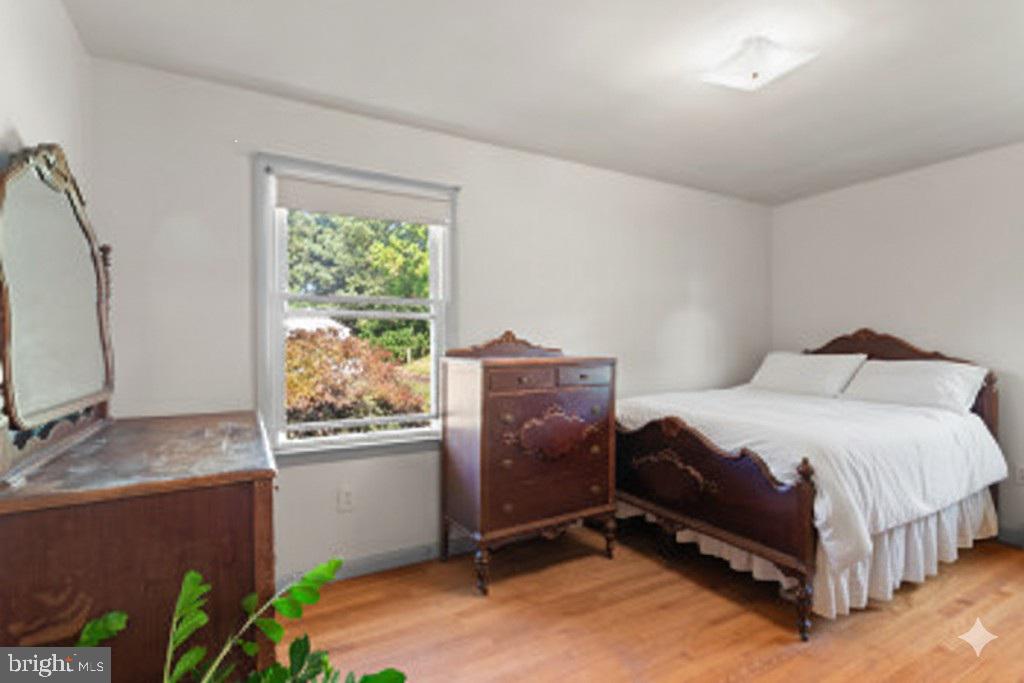 18 Hahn Road Westminster, MD 21157 - Photo 8 of 22 a bedroom with a bed dresser flowerpot and window