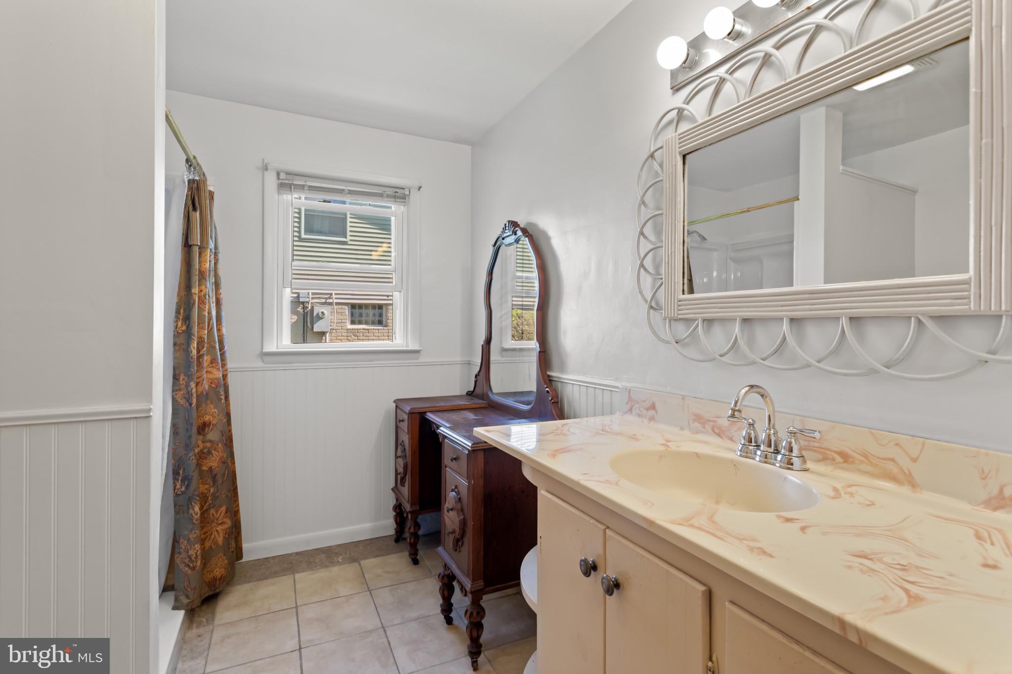 18 Hahn Road Westminster, MD 21157 - Photo 10 of 22 a bathroom with a sink and a mirror