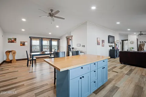 a living room with furniture and a lamp