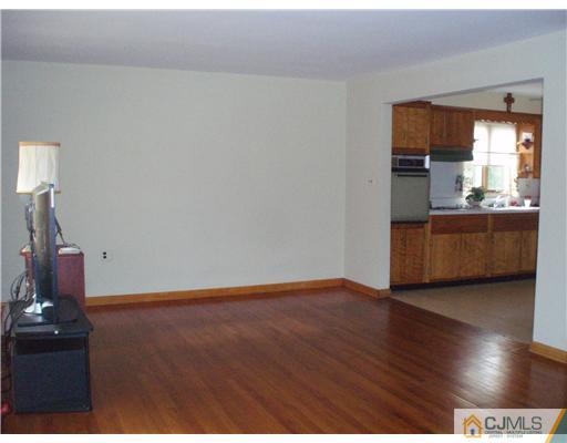 101 Kimberly Road Colonia, NJ 07067 - Photo 3 of 14 a view of kitchen and hall with wooden floor