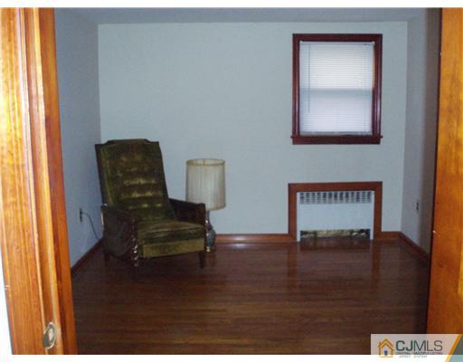 101 Kimberly Road Colonia, NJ 07067 - Photo 8 of 14 a view of a workspace with furniture and wooden floor