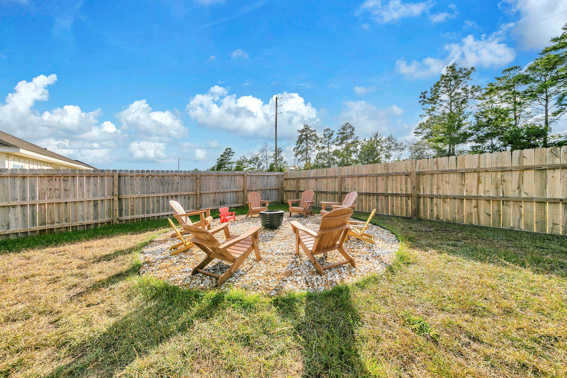 720 Quintana Street Crestview, FL 32539 - Photo 22 of 26 a view of a yard with furniture