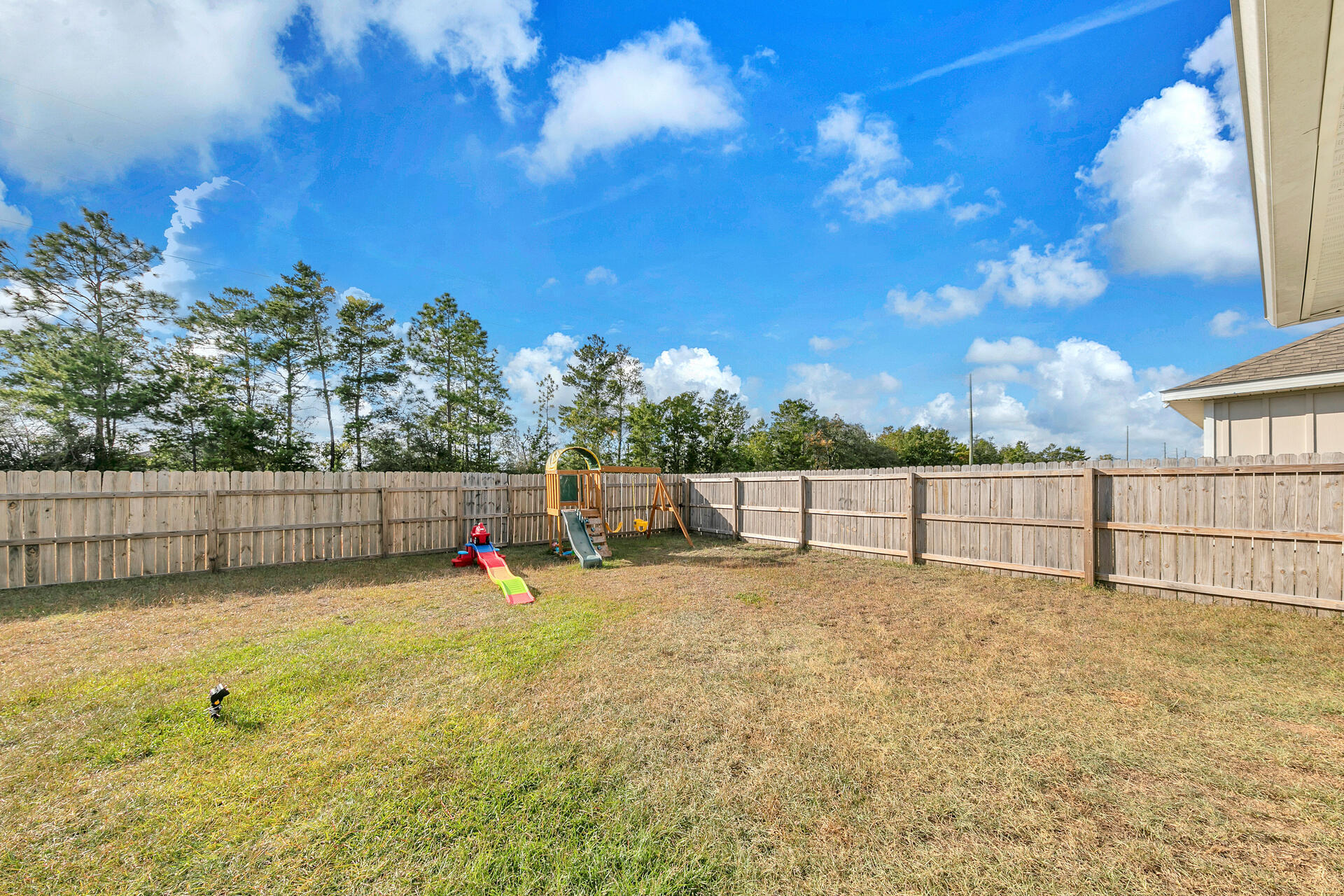 720 Quintana Street Crestview, FL 32539 - Photo 24 of 26 a view of backyard with wooden fence