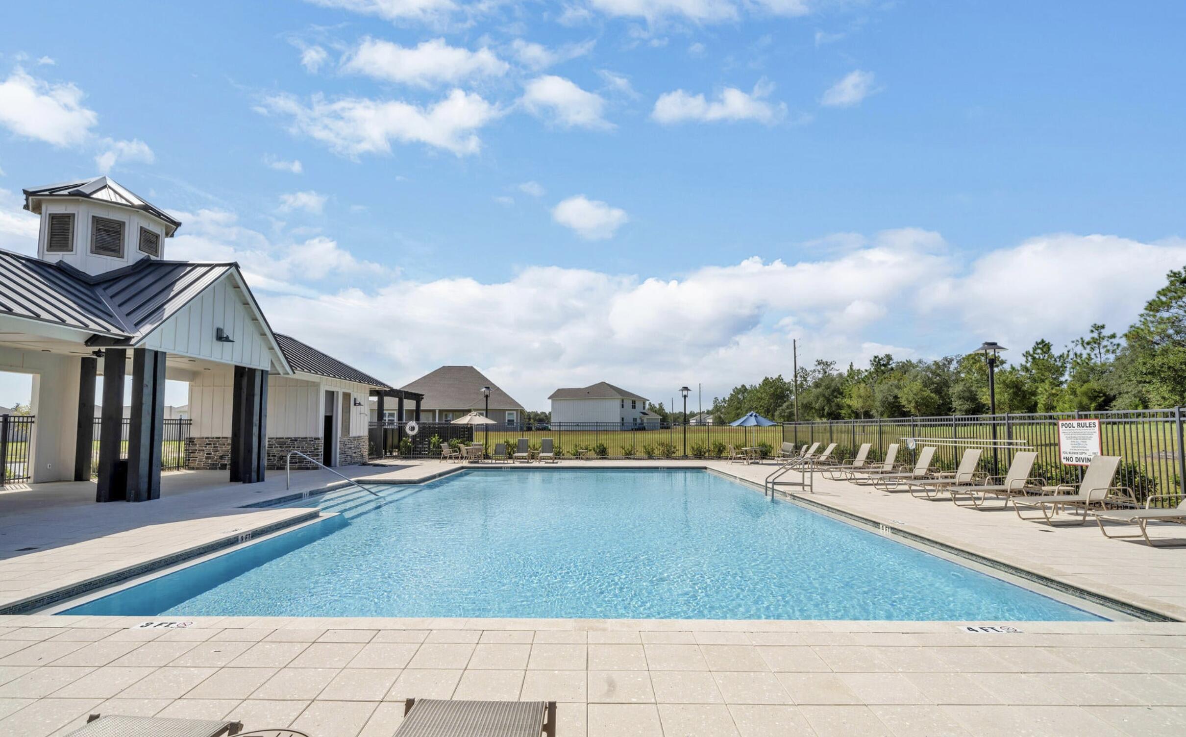 720 Quintana Street Crestview, FL 32539 - Photo 26 of 26 a view of a swimming pool with an outdoor seating