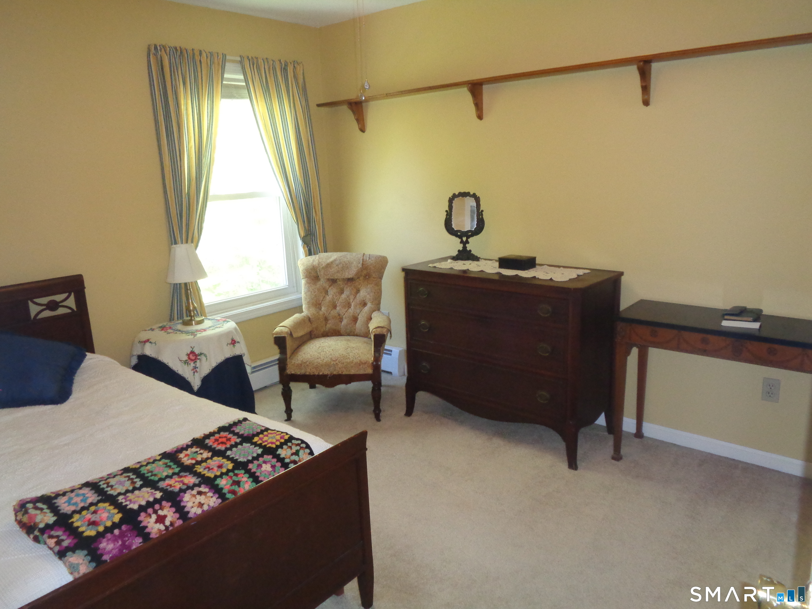 321 Spring Street Naugatuck, CT 06770 - Photo 15 of 27 a living room with furniture and a window