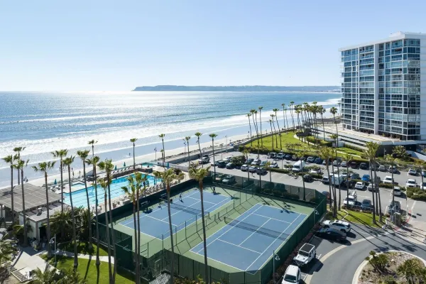 a view of swimming pool outdoor seating and city view