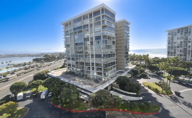 a view of a balcony with outdoor seating