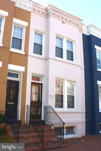 3314 Reservoir Road Northwest Washington, DC 20007 - Photo 1 of 7 a view of a brick building with many windows