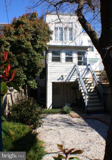 3314 Reservoir Road Northwest Washington, DC 20007 - Photo 3 of 7 a front view of a house with a yard