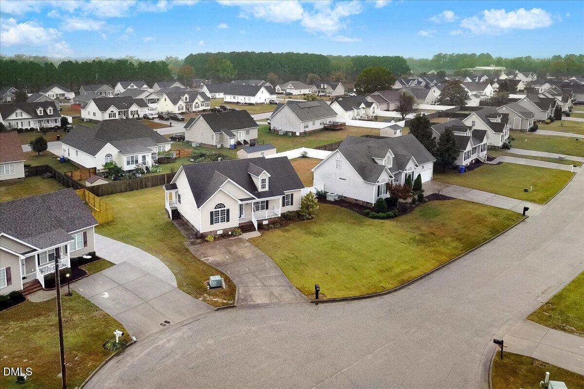4416 Sunflower Court Wilson, NC 27896 - Photo 10 of 39 an aerial view of a house with a swimming pool and mountains