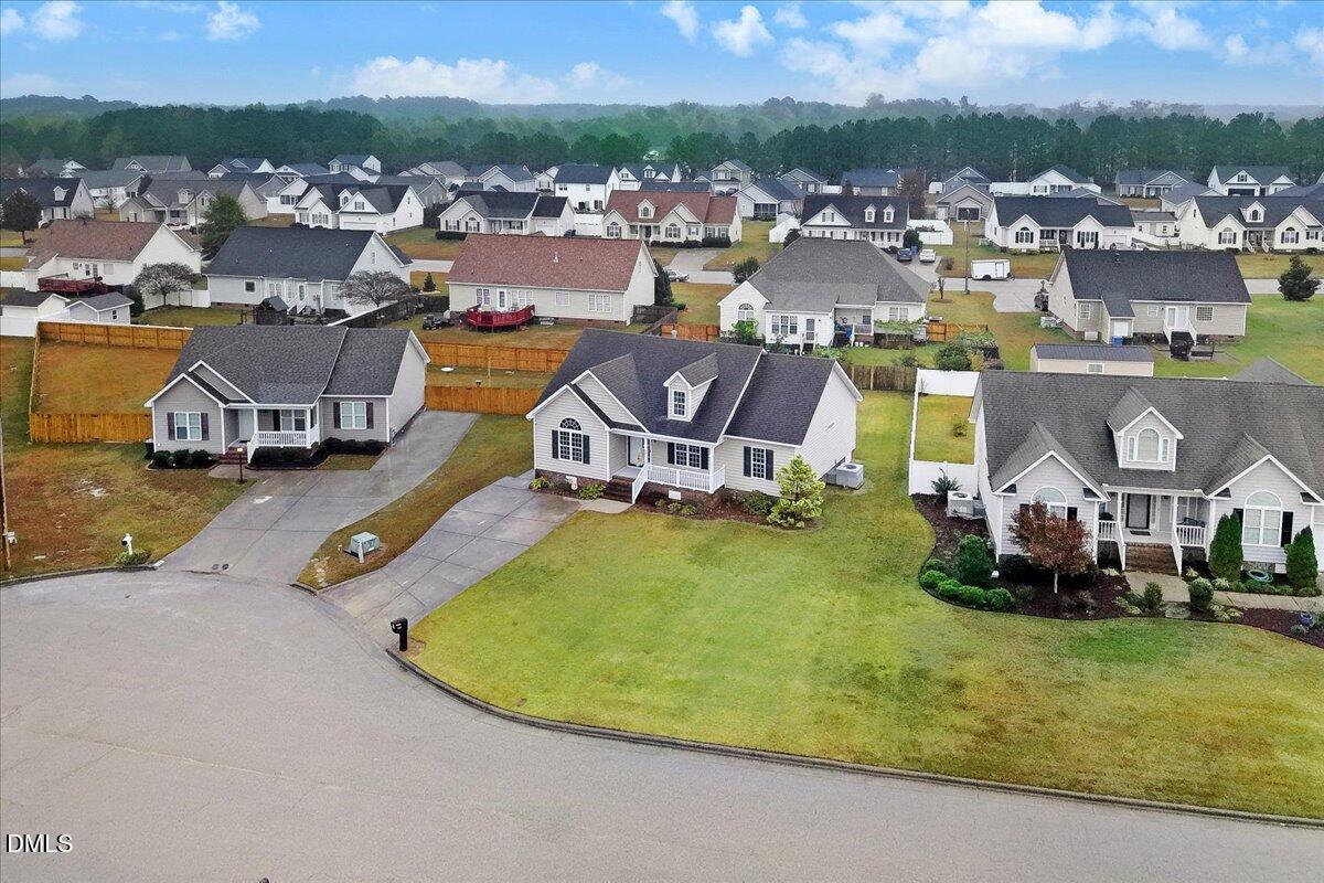 4416 Sunflower Court Wilson, NC 27896 - Photo 11 of 39 an aerial view of a house with a swimming pool and lake view