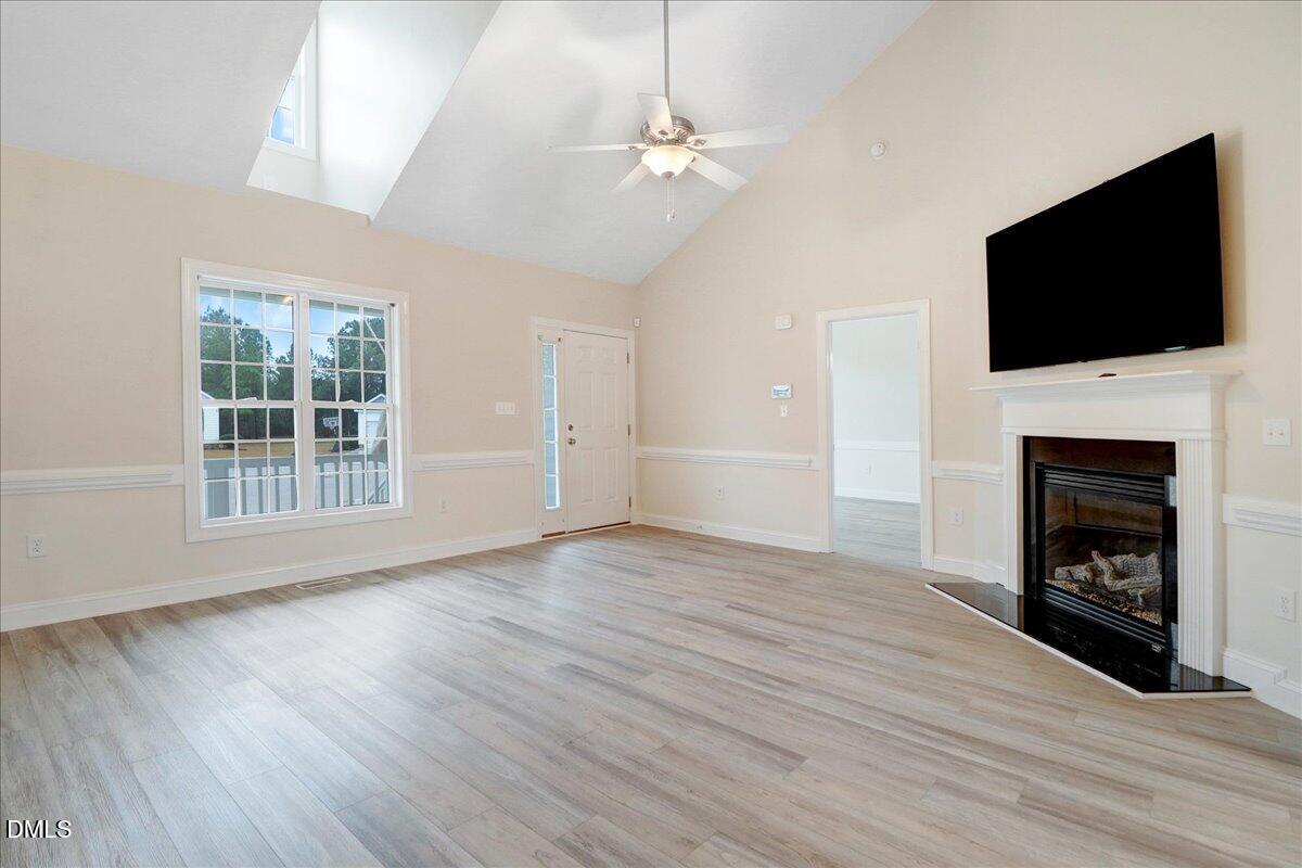 4416 Sunflower Court Wilson, NC 27896 - Photo 18 of 39 a view of an empty room with a fireplace and a window