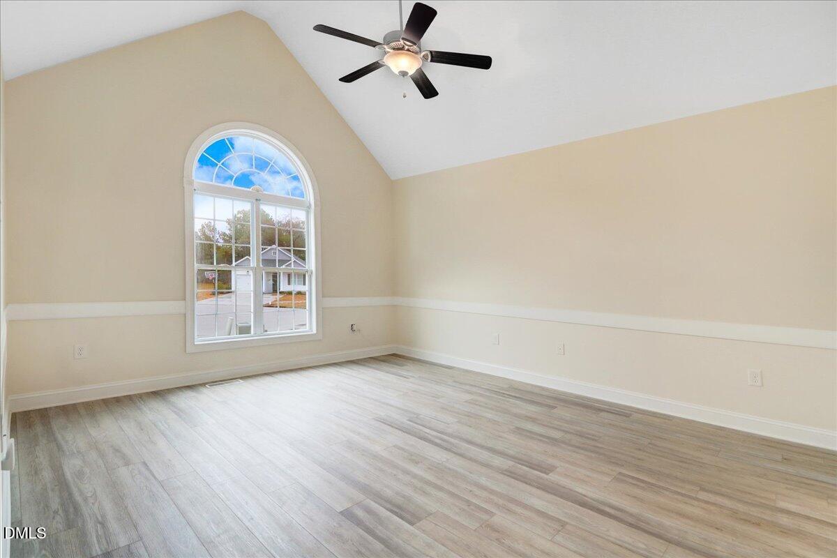 4416 Sunflower Court Wilson, NC 27896 - Photo 27 of 39 a view of a room with wooden floor and a ceiling fan