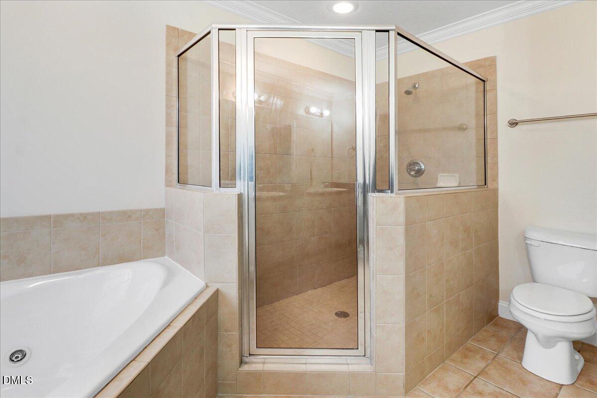 4416 Sunflower Court Wilson, NC 27896 - Photo 30 of 39 a bathroom with a shower and a toilet