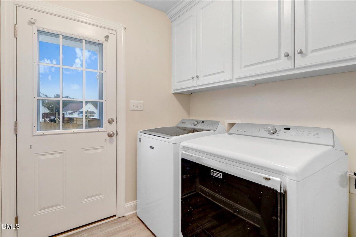 4416 Sunflower Court Wilson, NC 27896 - Photo 38 of 39 a utility room with dryer and washer