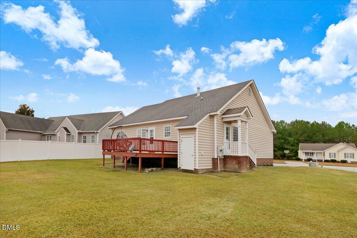 4416 Sunflower Court Wilson, NC 27896 - Photo 5 of 39 a view of a house with a backyard porch and sitting area