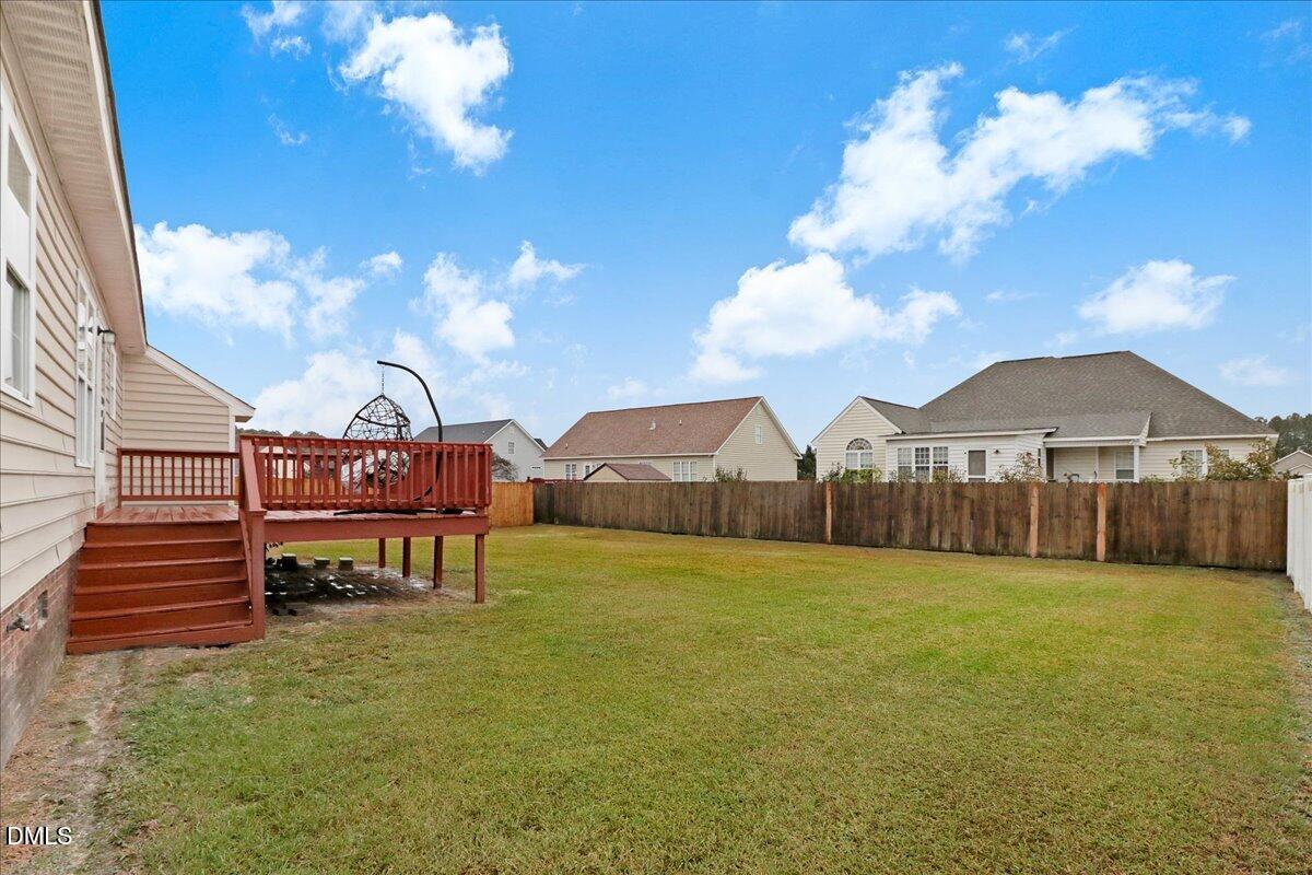4416 Sunflower Court Wilson, NC 27896 - Photo 6 of 39 a view of a house with a big yard plants and large trees