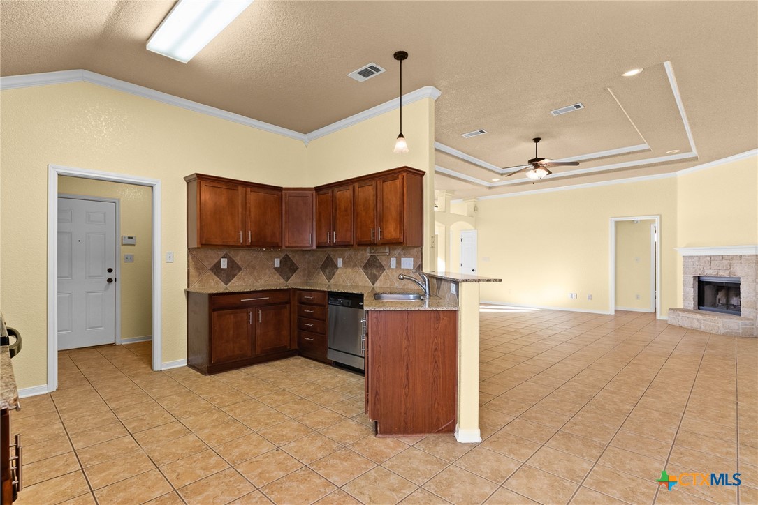 5705 Bald Ridge Court Killeen, TX 76542 - Photo 9 of 28 a kitchen with stainless steel appliances granite countertop a refrigerator a sink and dishwasher