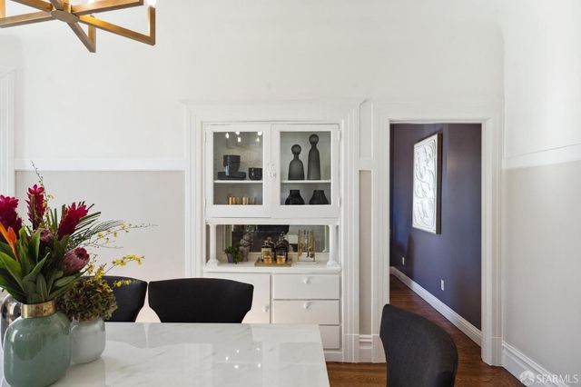 a view of living room filled with furniture and flower pot