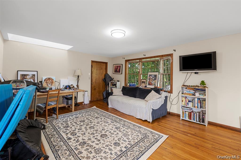 332 Springtown Road New Paltz, NY 12561 - Photo 12 of 19 a living room with furniture and a flat screen tv
