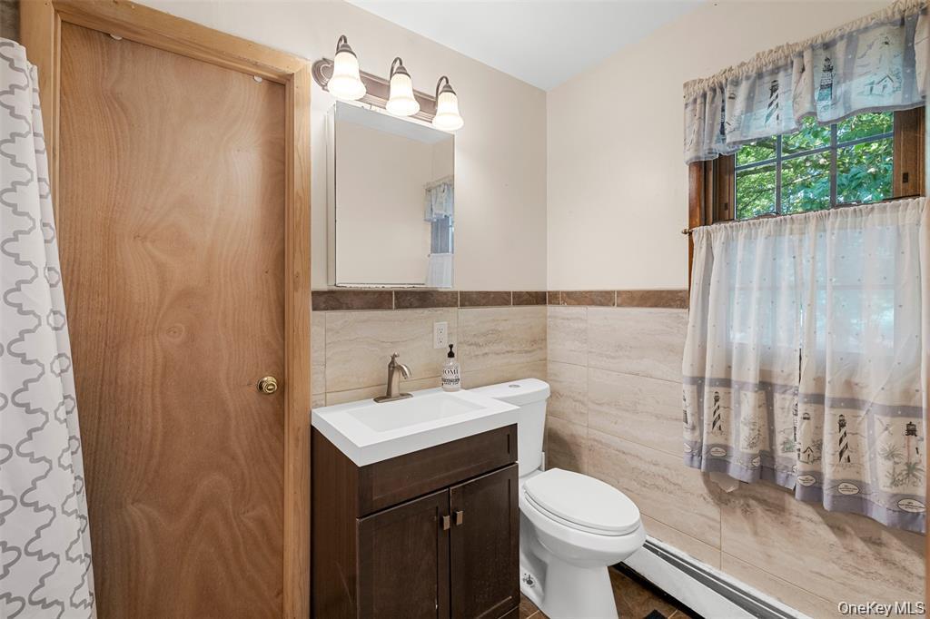 332 Springtown Road New Paltz, NY 12561 - Photo 16 of 19 a bathroom with a sink toilet and shower