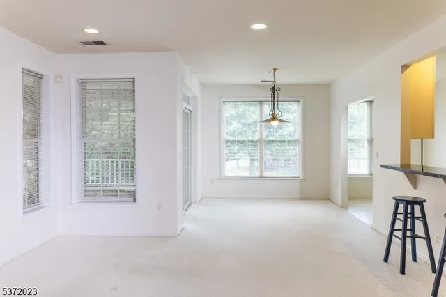 a view of livingroom with furniture window and front door