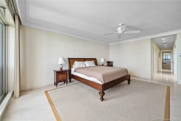 a bedroom with a bed and a table