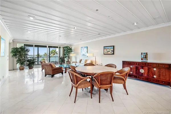 a view of a dining room with furniture window and outside view