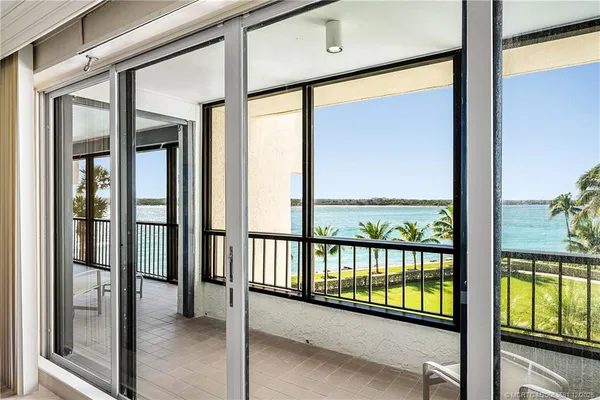 a view of a large building with a glass door