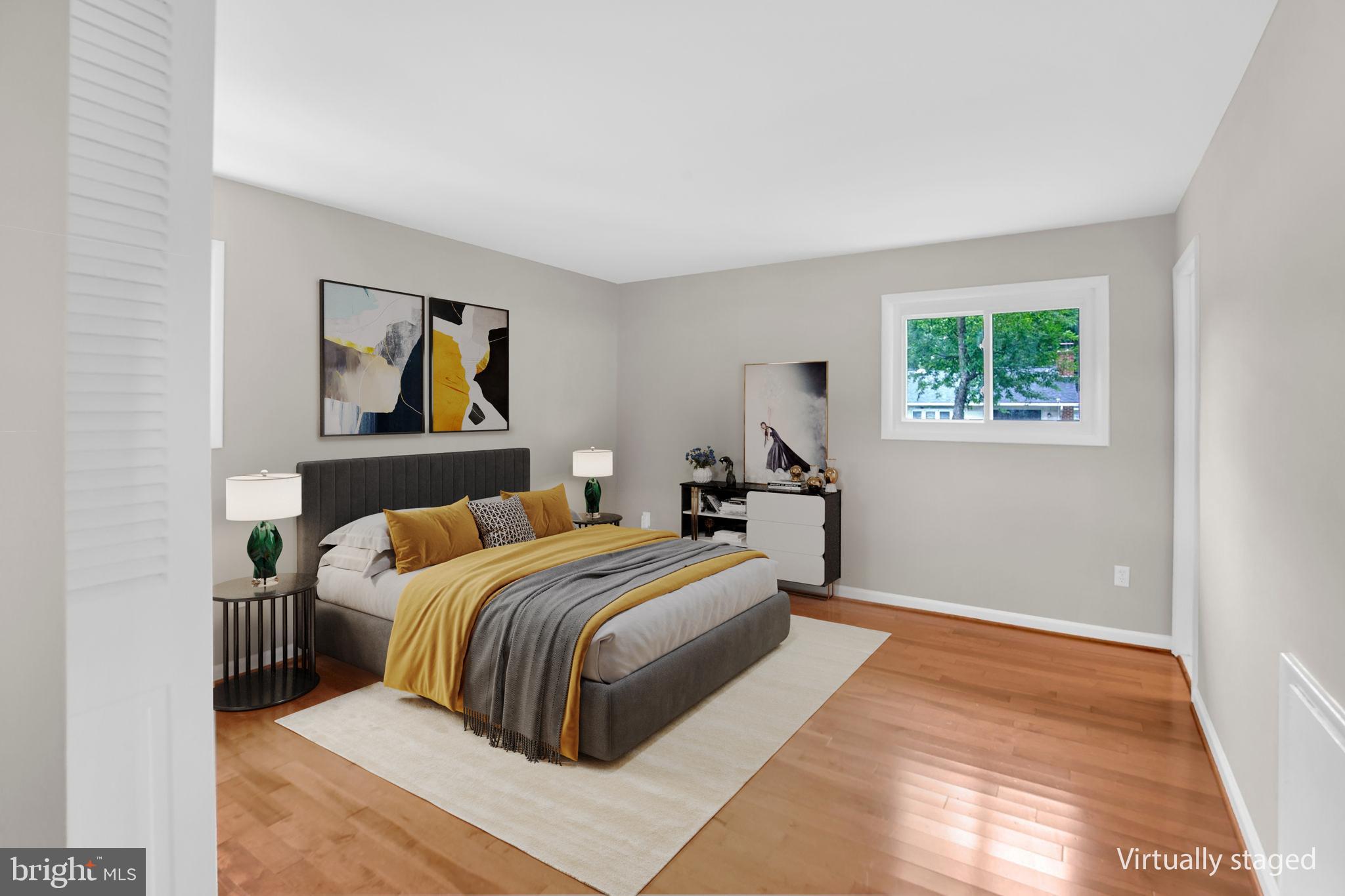 4403 Kinmount Road Lanham, MD 20706 - Photo 16 of 39 a bedroom with a bed and a painting on the wall