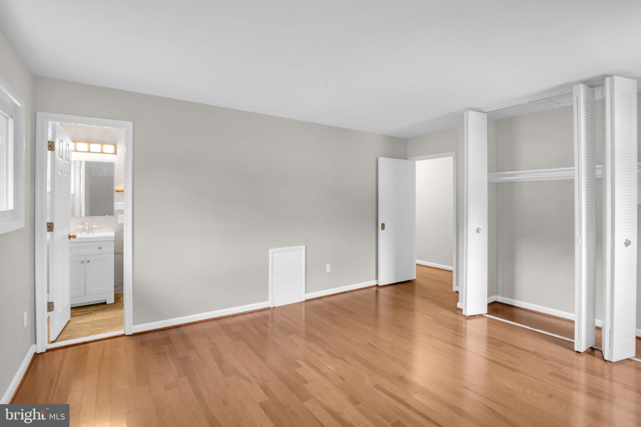 4403 Kinmount Road Lanham, MD 20706 - Photo 18 of 39 a view of an empty room with wooden floor and a window