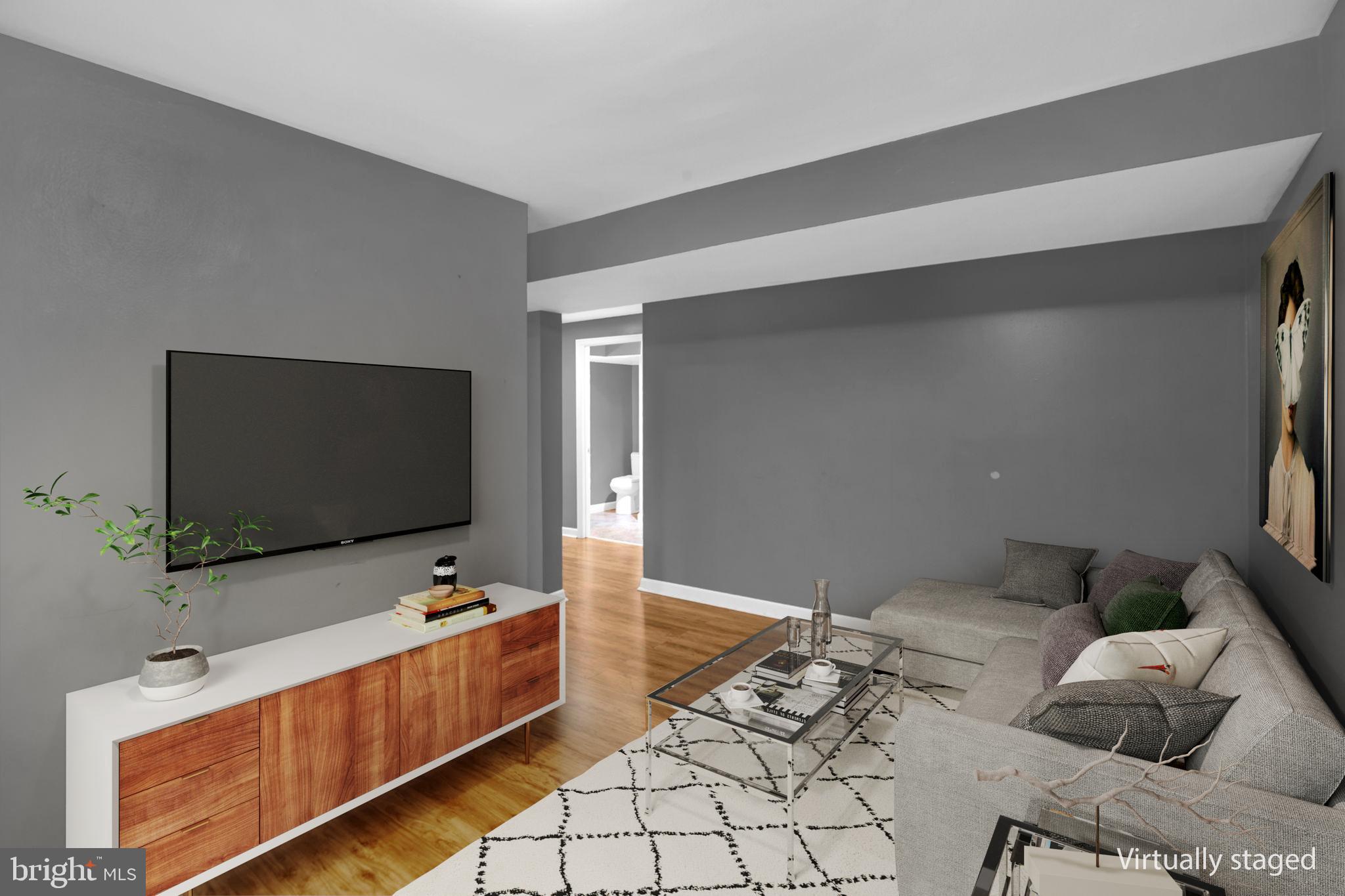 4403 Kinmount Road Lanham, MD 20706 - Photo 23 of 39 a room with furniture and a flat screen tv