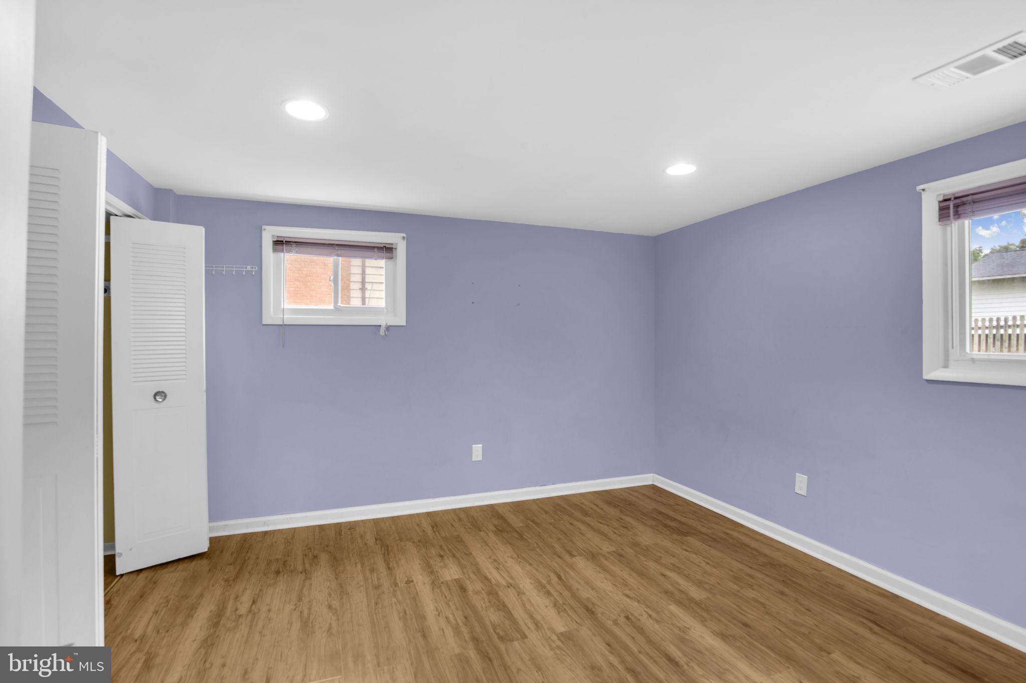4403 Kinmount Road Lanham, MD 20706 - Photo 29 of 39 a view of an empty room with wooden floor and a window