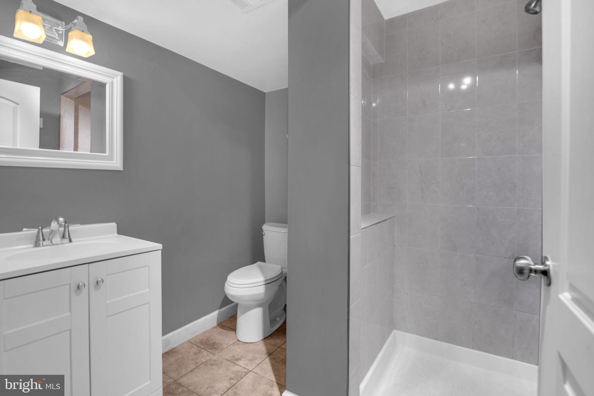 4403 Kinmount Road Lanham, MD 20706 - Photo 31 of 39 a bathroom with a sink toilet and vanity