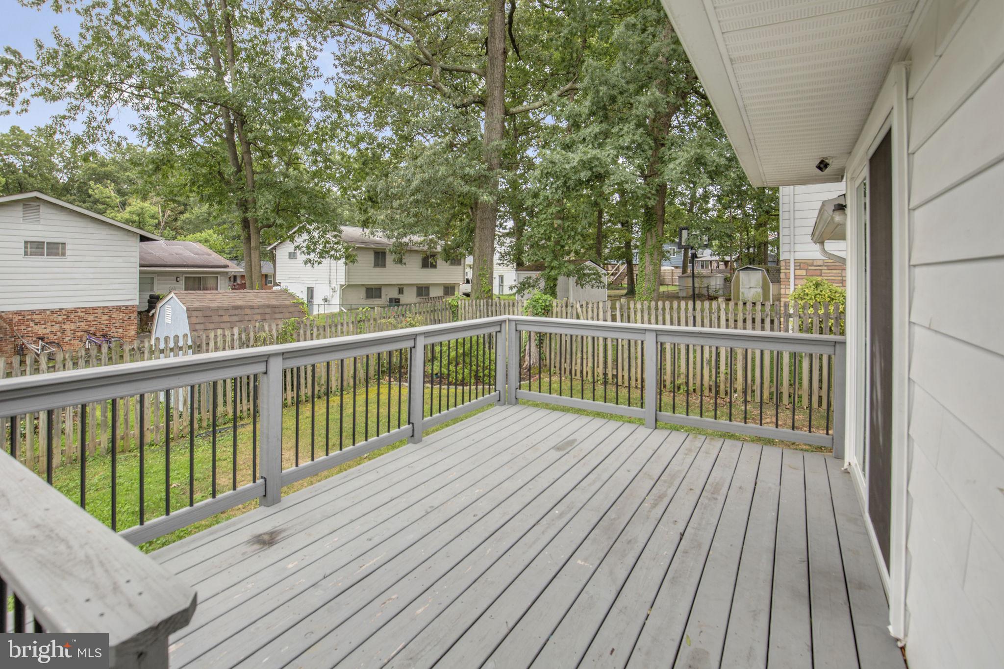 4403 Kinmount Road Lanham, MD 20706 - Photo 35 of 39 a view of deck with wooden floor and fence