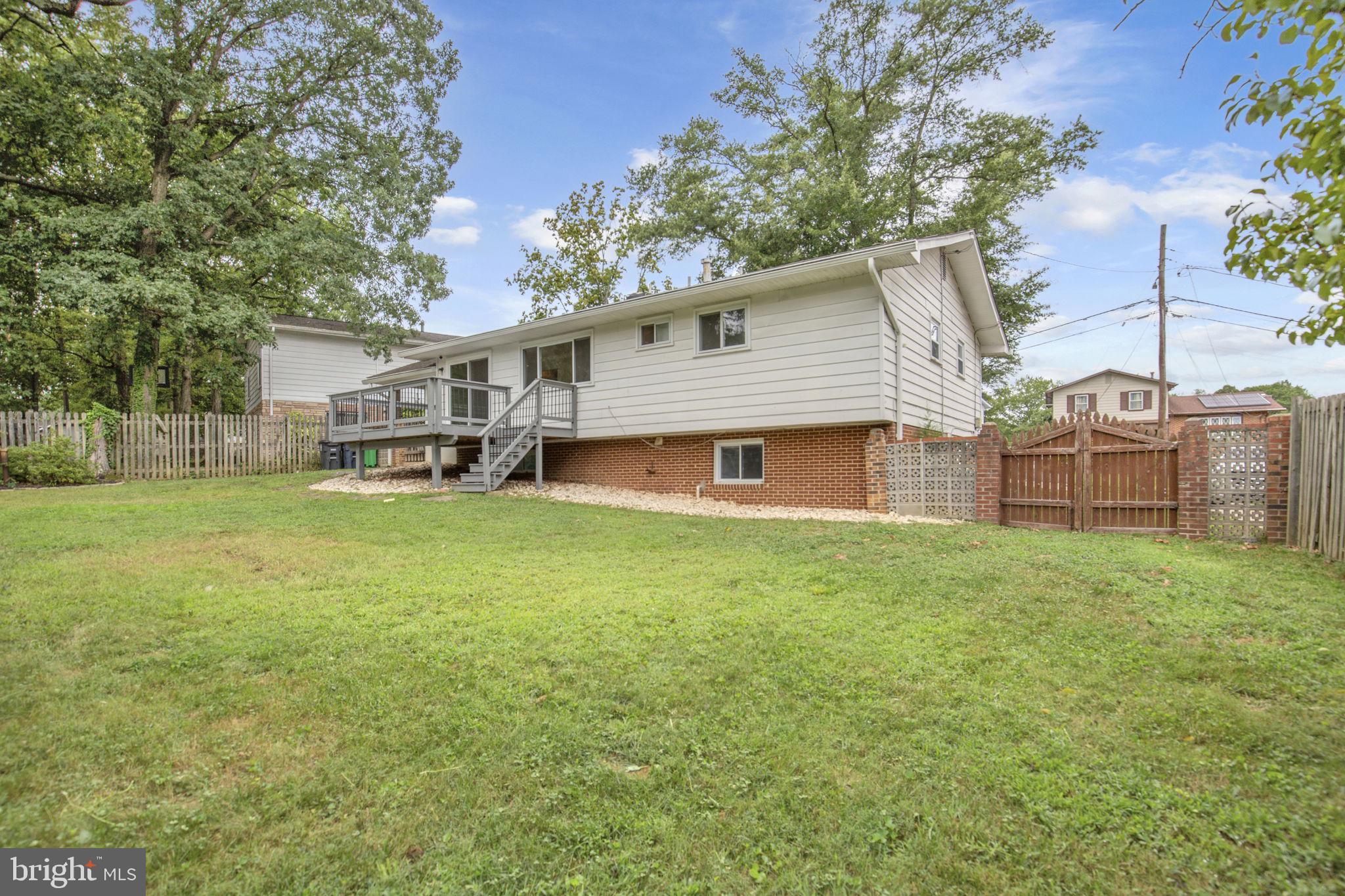 4403 Kinmount Road Lanham, MD 20706 - Photo 37 of 39 a view of a house with a yard porch and sitting area