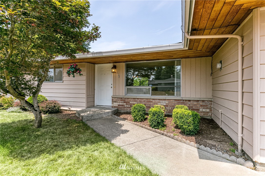 2608 Northeast 18th Street Renton, WA 98056 - Photo 2 of 20 a front view of a house with a yard