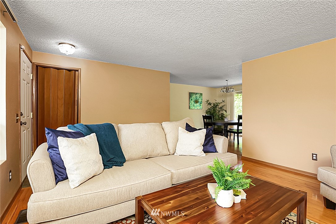 2608 Northeast 18th Street Renton, WA 98056 - Photo 4 of 20 a living room with furniture flowerpot and wooden floor