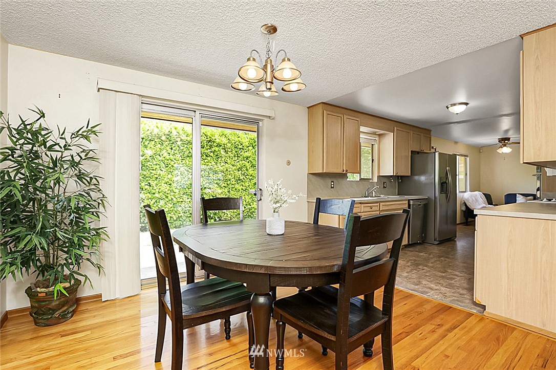 2608 Northeast 18th Street Renton, WA 98056 - Photo 5 of 20 a view of a dining room with furniture window and wooden floor