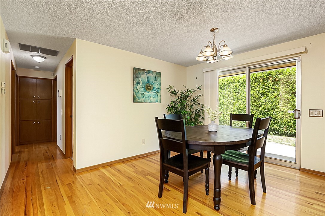 2608 Northeast 18th Street Renton, WA 98056 - Photo 6 of 20 a view of a dining room with furniture window and wooden floor