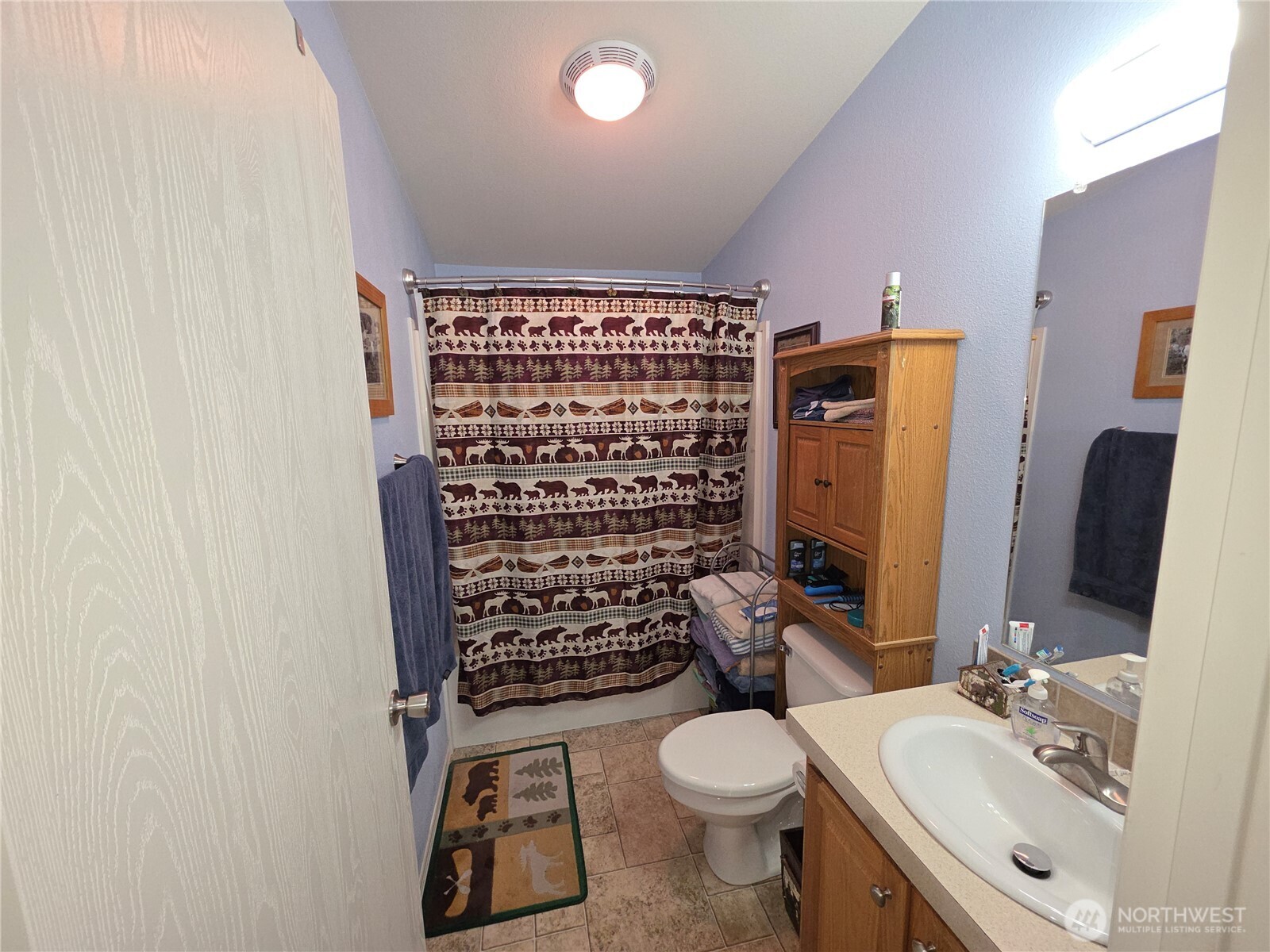 393 Summer Road Tonasket, WA 98855 - Photo 5 of 37 a bathroom with a toilet sink and shower