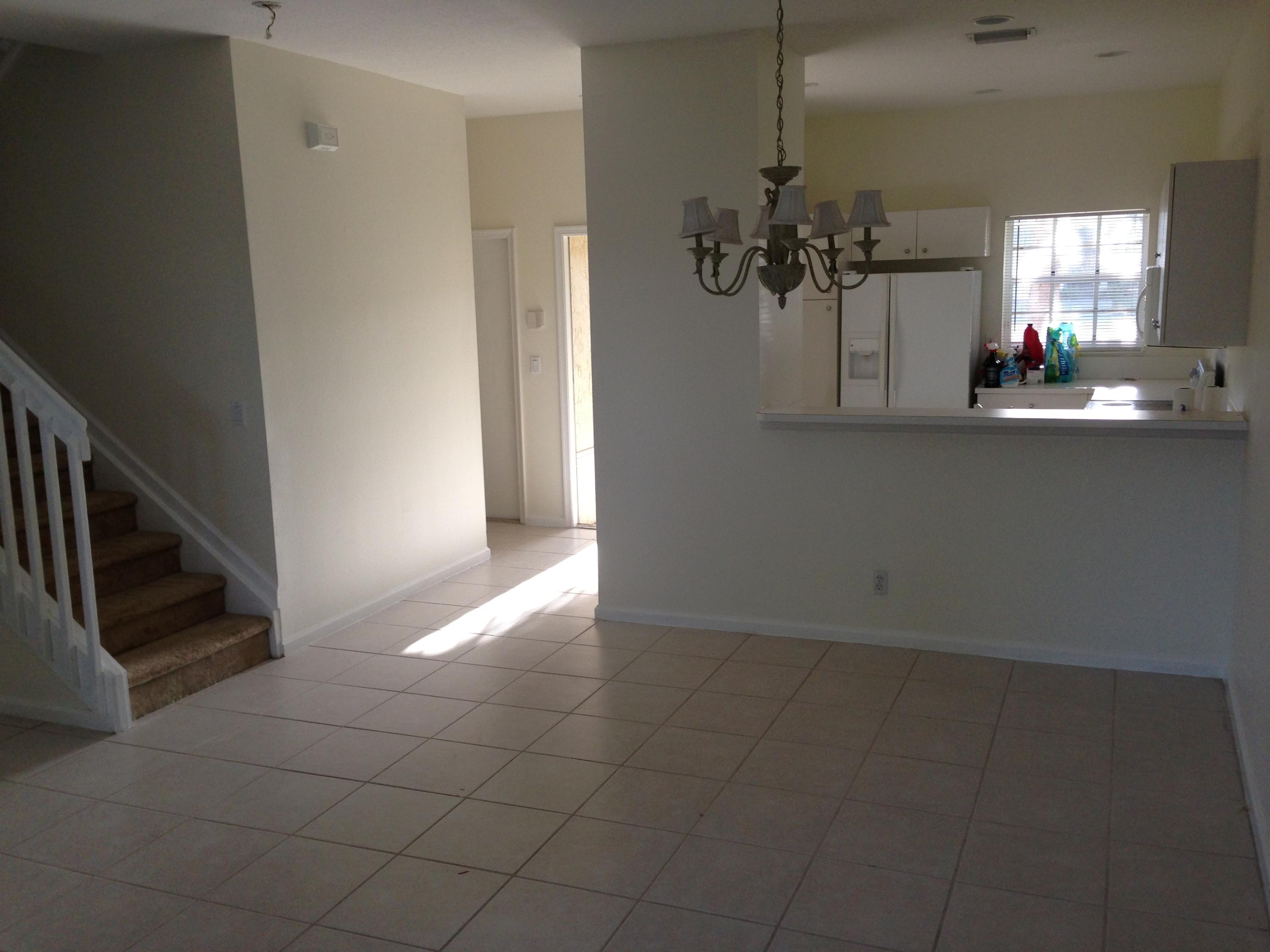 18152 Boca Way Drive Boca Raton, FL 33498 - Photo 3 of 6 a view of a hallway with a chandelier