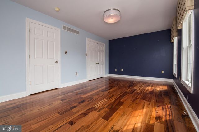 a view of room with wooden floor