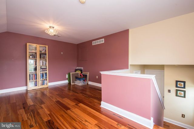 a view of a livingroom with furniture and a workspace