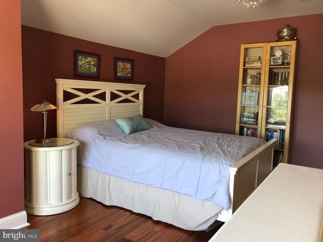 a bedroom with a bed and a tv in it