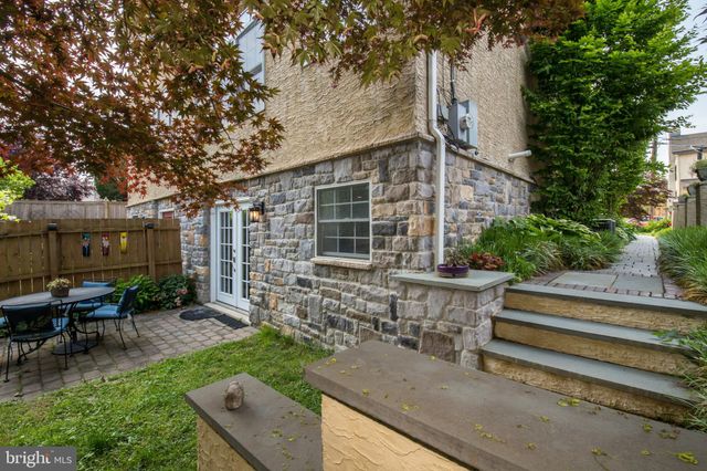 a backyard of a house with outdoor seating